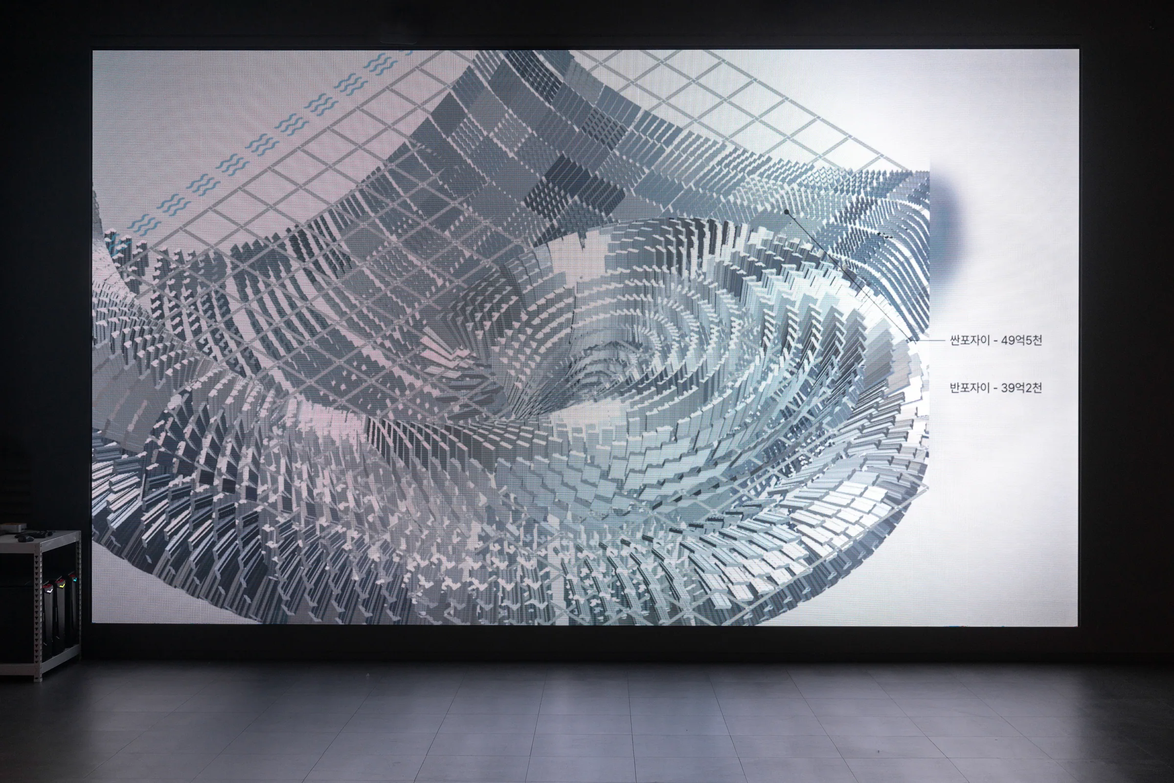 Jeanyoon Choi, ∫ (Banpo-Xism) (2026) — media wall detail: the grid rotates while labels such as 'Banpo Xi · 4.95 billion KRW' surface across it.