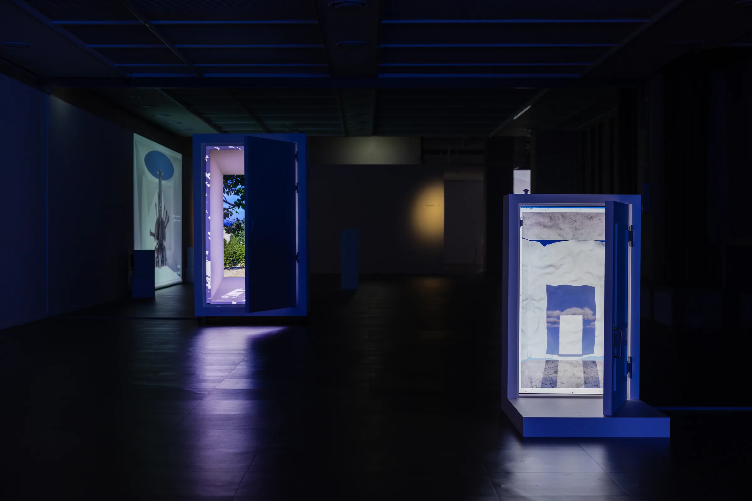 Minhyeok Seo, City'scape + Tied (2026) — the small door and the large door at the end of an alley-like circulation. A private cut inside the city.